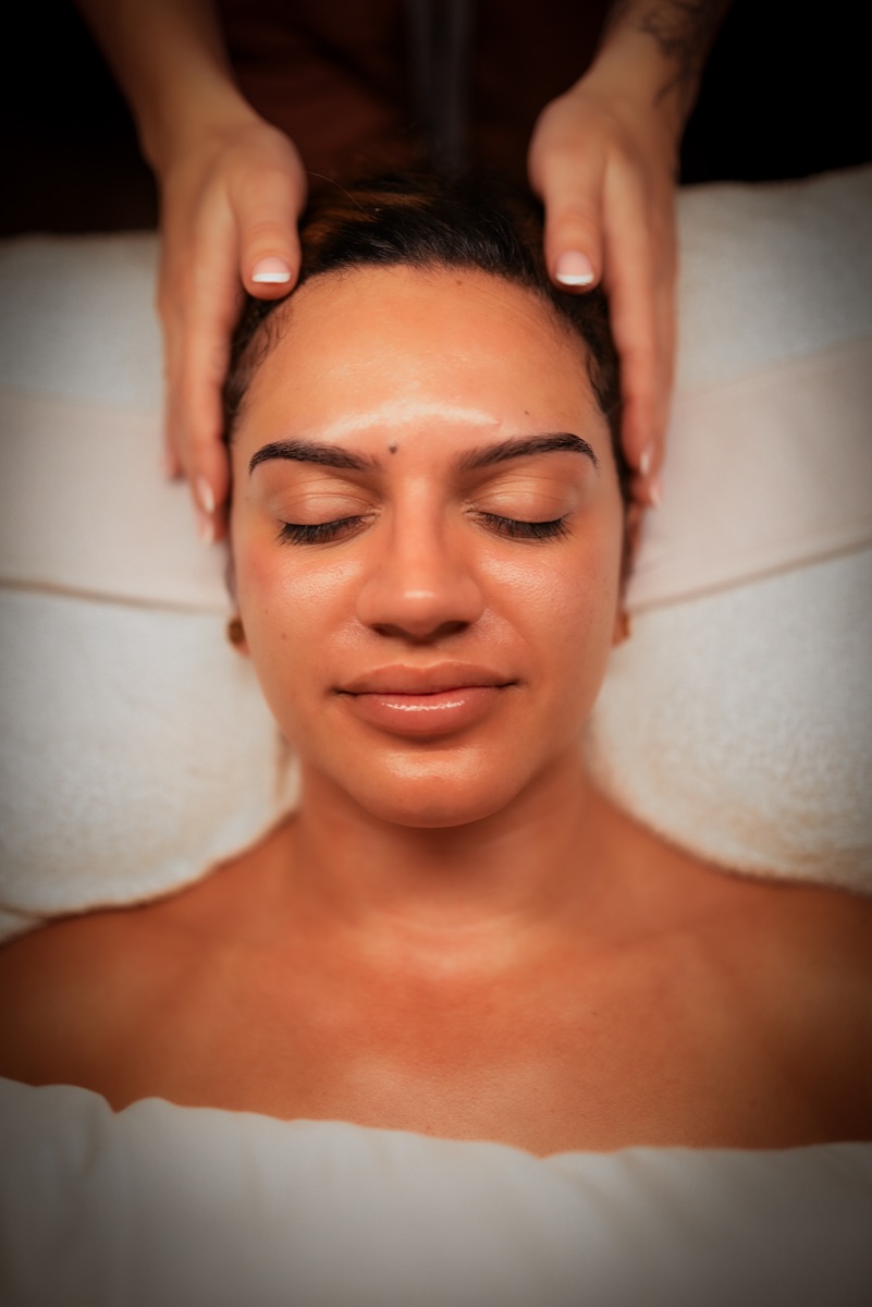 Client receiving a facial treatment at Glow by Gia